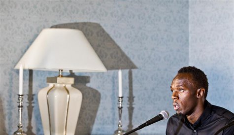 Sprinting champion Usain Bolt of Jamaica speaks during a news conference at the Russian embassy June 11, 2013. REUTERS/Vegard Grott/NTB Scan Sprinting champion Usain Bolt of Jamaica speaks during a news conference at the Russian embassy June 11, 2013. REUTERS/Vegard Grott/NTB Scan