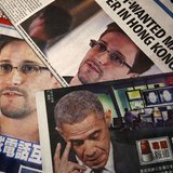 Photos of Edward Snowden, a contractor at the National Security Agency (NSA), and U.S. President Barack Obama are printed on the front pages