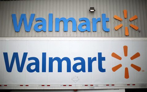 Wal-Mart Stores Inc logos is seen at a company distribution center in Bentonville, Arkansas, in this June 6, 2013 file photo. REUTERS/Rick W Wal-Mart Stores Inc logos is seen at a company distribution center in Bentonville, Arkansas, in this June 6, 2013 file photo. REUTERS/Rick W