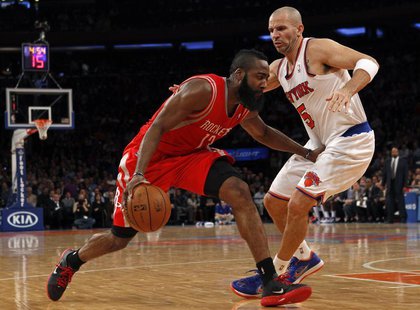 Houston Rockets guard James Harden (L) drives to the basket defended by New York Knicks point guard Jason Kidd in the second quarter of thei Houston Rockets guard James Harden (L) drives to the basket defended by New York Knicks point guard Jason Kidd in the second quarter of thei