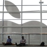 Attendees sit in front of an Apple logo at the Apple Worldwide Developers Conference (WWDC) 2013 in San Francisco, California June 10, 2013. Attendees sit in front of an Apple logo at the Apple Worldwide Developers Conference (WWDC) 2013 in San Francisco, California June 10, 2013.