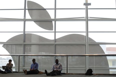 Attendees sit in front of an Apple logo at the Apple Worldwide Developers Conference (WWDC) 2013 in San Francisco, California June 10, 2013. Attendees sit in front of an Apple logo at the Apple Worldwide Developers Conference (WWDC) 2013 in San Francisco, California June 10, 2013.