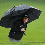 Phil Mickelson of the U.S. reviews his shot from the greenside bunker on the 15th hole during the final round of the Wells Fargo Championshi