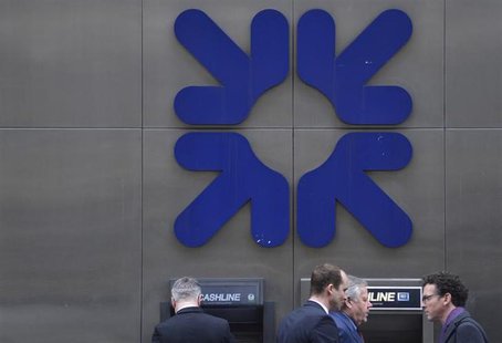 Pedestrians walk past a Royal Bank of Scotland (RBS) branch in the City of London March 6, 2013. REUTERS/Toby Melville Pedestrians walk past a Royal Bank of Scotland (RBS) branch in the City of London March 6, 2013. REUTERS/Toby Melville