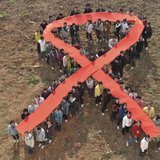 Students form a red ribbon during an HIV/AIDS awareness rally ahead of World AIDS Day in Hanshan county, Anhui province, November 29, 2010. Students form a red ribbon during an HIV/AIDS awareness rally ahead of World AIDS Day in Hanshan county, Anhui province, November 29, 2010.
