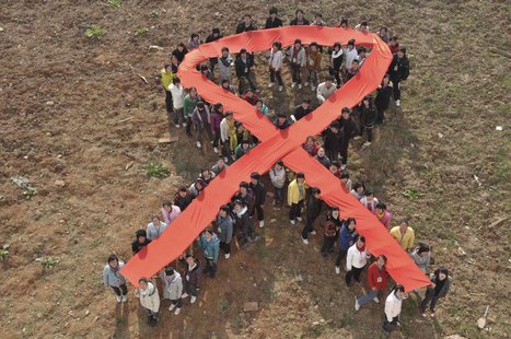 Students form a red ribbon during an HIV/AIDS awareness rally ahead of World AIDS Day in Hanshan county, Anhui province, November 29, 2010. Students form a red ribbon during an HIV/AIDS awareness rally ahead of World AIDS Day in Hanshan county, Anhui province, November 29, 2010.