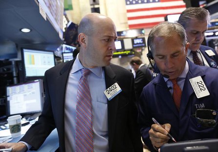 Traders work on the floor at the New York Stock Exchange, June 12, 2013. REUTERS/Brendan McDermid Traders work on the floor at the New York Stock Exchange, June 12, 2013. REUTERS/Brendan McDermid