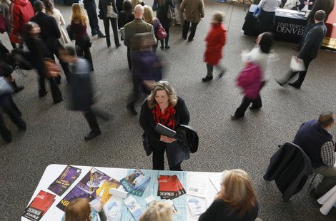 A job seeker (C) talks to an exhibitor at the Colorado Hospital Association health care career fair in Denver April 9, 2013. REUTERS/Rick Wi A job seeker (C) talks to an exhibitor at the Colorado Hospital Association health care career fair in Denver April 9, 2013. REUTERS/Rick Wi