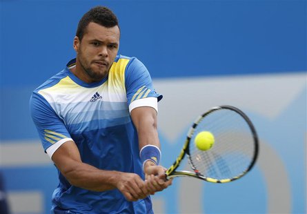France's Jo-Wilfried Tsonga returns the ball during his men's singles tennis match against his fellow countryman Edouard Roger-Vasselin at t France's Jo-Wilfried Tsonga returns the ball during his men's singles tennis match against his fellow countryman Edouard Roger-Vasselin at t