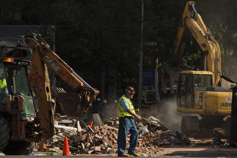 A construction worker walks near the debris following a building collapse in Philadelphia June 5, 2013. REUTERS/Eduardo Munoz A construction worker walks near the debris following a building collapse in Philadelphia June 5, 2013. REUTERS/Eduardo Munoz