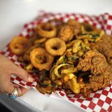 A woman holds a plate of fried food at the Los Angeles County Fair in Pomona, California September 5, 2012. REUTERS/Lucy Nicholson