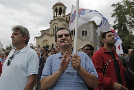 Supporters of the communist-affiliated trade union PAME take part in a rally near the headquarters of Greek state broadcaster ERT at Aghia P Supporters of the communist-affiliated trade union PAME take part in a rally near the headquarters of Greek state broadcaster ERT at Aghia P