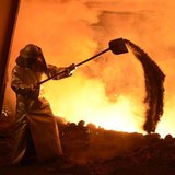 A steel-worker is pictured at a furnace at the plant of German steel company Salzgitter AG in Salzgitter, Lower Saxony on March 21, 2012. RE