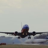 A Southwest Airlines passenger jet lifts off at Reagan National Airport in Washington February 28, 2013. REUTERS/Gary Cameron