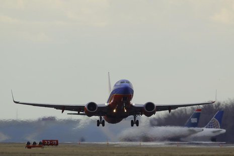 A Southwest Airlines passenger jet lifts off at Reagan National Airport in Washington February 28, 2013. REUTERS/Gary Cameron A Southwest Airlines passenger jet lifts off at Reagan National Airport in Washington February 28, 2013. REUTERS/Gary Cameron