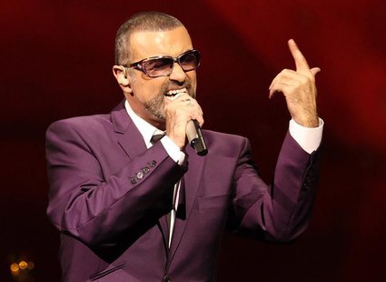 British singer George Michael performs on stage during his "Symphonica" tour concert in Vienna September 4, 2012. REUTERS/Heinz-Peter Bader British singer George Michael performs on stage during his "Symphonica" tour concert in Vienna September 4, 2012. REUTERS/Heinz-Peter Bader