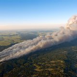 An aerial photo shows wildfire burning homes in Black Forest community near Colorado Springs, Colorado June 11 2013. REUTERS/John Wark An aerial photo shows wildfire burning homes in Black Forest community near Colorado Springs, Colorado June 11 2013. REUTERS/John Wark