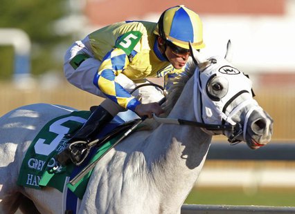 Jockey Ramon Dominguez aboard Hansen races to win first place in the Juvenile race during the 2011 Breeders' Cup World Championship horse ra Jockey Ramon Dominguez aboard Hansen races to win first place in the Juvenile race during the 2011 Breeders' Cup World Championship horse ra