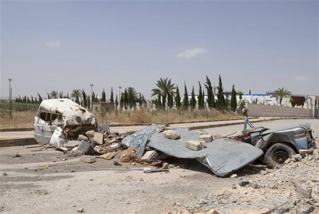 Barricades are seen on a street in Aleppo's countryside, June 13, 2013. REUTERS/George Ourfalian Barricades are seen on a street in Aleppo's countryside, June 13, 2013. REUTERS/George Ourfalian