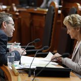 Swiss Finance Minister Eveline Widmer-Schlumpf (R) talks to Councillor of State Primin Bischof during a debate on the tax agreement between 