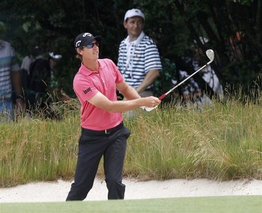 Belgium's Nicolas Colsaerts watches his second shot from a bunker on the first hole during the first round of the 2013 U.S. Open golf champi Belgium's Nicolas Colsaerts watches his second shot from a bunker on the first hole during the first round of the 2013 U.S. Open golf champi