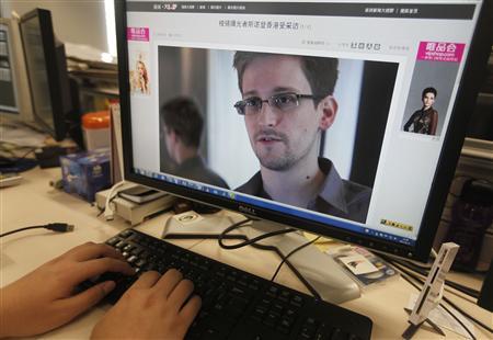 A picture of Edward Snowden, a contractor at the National Security Agency (NSA), is seen on a computer screen displaying a page of a Chinese news website, in Beijing in this June 13, 2013 photo illustration.
(Credit: Reuters/Jason Lee) A picture of Edward Snowden, a contractor at the National Security Agency (NSA), is seen on a computer screen displaying a page of a Chinese news website, in Beijing in this June 13, 2013 photo illustration.
(Credit: Reuters/Jason Lee)