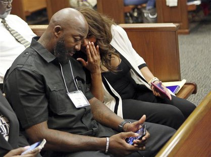 Attorney Natalie Jackson talks to Tracy Martin, father of Trayvon Martin, in Seminole circuit court during the fourth day of jury selection Attorney Natalie Jackson talks to Tracy Martin, father of Trayvon Martin, in Seminole circuit court during the fourth day of jury selection