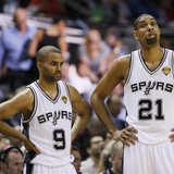 San Antonio Spurs' Tim Duncan (R), Tony Parker (C) and Kawhi Leonard stand during a break in play against the Miami Heat during the second q San Antonio Spurs' Tim Duncan (R), Tony Parker (C) and Kawhi Leonard stand during a break in play against the Miami Heat during the second q