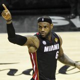 Miami Heat's LeBron James reacts a basket against the San Antonio Spurs during the second half in Game 4 of their NBA Finals basketball seri