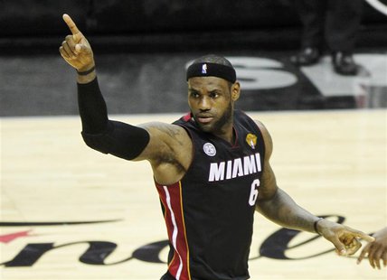 Miami Heat's LeBron James reacts a basket against the San Antonio Spurs during the second half in Game 4 of their NBA Finals basketball seri Miami Heat's LeBron James reacts a basket against the San Antonio Spurs during the second half in Game 4 of their NBA Finals basketball seri