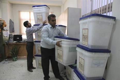 Officials prepare ballot boxes for Friday's presidential and city council elections in the northern Iranian city of Amol June 13, 2013. REUT Officials prepare ballot boxes for Friday's presidential and city council elections in the northern Iranian city of Amol June 13, 2013. REUT