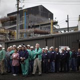 Steelworkers wait to meet U.S. President Barack Obama during a change of shift at V&M Star, in Youngstown, Ohio in this taken May 18, 2010 f