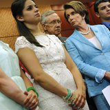 U.S. Senate Majority Leader Harry Reid (D-NV) (3rd L) and House Minority Leader Nancy Pelosi (D-CA) (2nd R) stand with Jillian Soto (L), Car