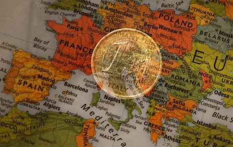 A picture illustration taken with the multiple exposure function of the camera shows a one Euro coin and a map of Europe, January 9, 2013. R A picture illustration taken with the multiple exposure function of the camera shows a one Euro coin and a map of Europe, January 9, 2013. R
