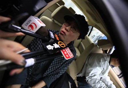 Liu Xia, wife of jailed Nobel Peace Prize Laureate Liu Xiaobo, talks to journalists after a trial outside a court in the Huairou district of Liu Xia, wife of jailed Nobel Peace Prize Laureate Liu Xiaobo, talks to journalists after a trial outside a court in the Huairou district of