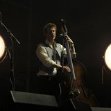 Bass player Ted Dwane performs with his band Mumford and Sons on the main stage during the 2nd day of the Coachella Valley Music & Arts Fest Bass player Ted Dwane performs with his band Mumford and Sons on the main stage during the 2nd day of the Coachella Valley Music & Arts Fest