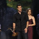 Cast member Henry Cavill speaks, accompanied by director Zack Snyder (L), co-stars Russell Crowe and Amy Adams as they accept the Most Antic
