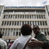 Protesters stand in front of the Greek state television ERT headquarters in Athens June 12, 2013. REUTERS/Yorgos Karahalis Protesters stand in front of the Greek state television ERT headquarters in Athens June 12, 2013. REUTERS/Yorgos Karahalis