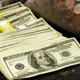 U.S. currency and coins in a vault at a bank in Westminster, Colorado November 3, 2009. REUTERS/Rick Wilking