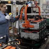 A Ford Motor production worker assembles batteries for Ford electric and hybrid vehicles at the Ford Rawsonville Assembly Plant in Ypsilanti
