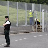 A Police Service of Northern Ireland officer guards the road to the Lough Erne Golf Resort where the G8 summit will be held next week, in Co A Police Service of Northern Ireland officer guards the road to the Lough Erne Golf Resort where the G8 summit will be held next week, in Co