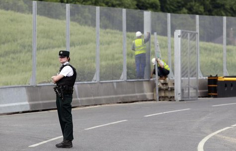 A Police Service of Northern Ireland officer guards the road to the Lough Erne Golf Resort where the G8 summit will be held next week, in Co A Police Service of Northern Ireland officer guards the road to the Lough Erne Golf Resort where the G8 summit will be held next week, in Co