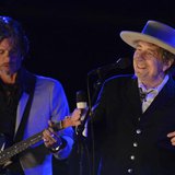 U.S. musician Bob Dylan (R) performs on the second day of the Hop Farm Music Festival in Paddock Wood, Kent June 30, 2012. REUTERS/ Ki Price