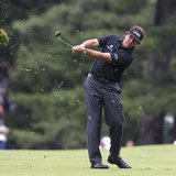 Phil Mickelson of the U.S. makes his second shot on the first hole during the first round of the 2013 U.S. Open golf championship at the Mer