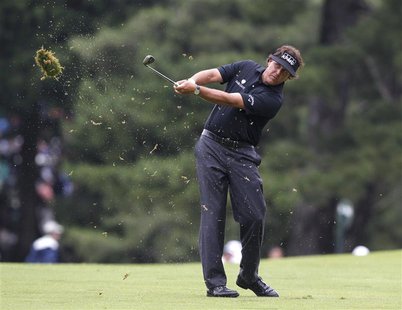 Phil Mickelson of the U.S. makes his second shot on the first hole during the first round of the 2013 U.S. Open golf championship at the Mer Phil Mickelson of the U.S. makes his second shot on the first hole during the first round of the 2013 U.S. Open golf championship at the Mer
