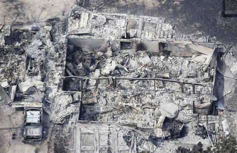 An aerial view of a destroyed house in the aftermath of the Black Forest Fire in Black Forest, Colorado June 13, 2013. REUTERS/Rick Wilking An aerial view of a destroyed house in the aftermath of the Black Forest Fire in Black Forest, Colorado June 13, 2013. REUTERS/Rick Wilking