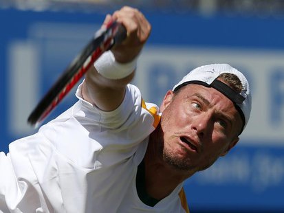 Australia's Lleyton Hewitt serves during his men's singles tennis match against Argentina's Juan Martin Del Potro at the Queen's Club Champi Australia's Lleyton Hewitt serves during his men's singles tennis match against Argentina's Juan Martin Del Potro at the Queen's Club Champi