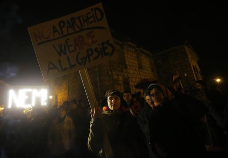 Hungarians attend a demonstration after parliament voted for government-backed constitutional amendments, in Budapest March 11, 2013. REUTER Hungarians attend a demonstration after parliament voted for government-backed constitutional amendments, in Budapest March 11, 2013. REUTER