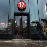 Pedestrians walk past a Lululemon Athletica store in New York, March 19, 2013. REUTERS/Lucas Jackson