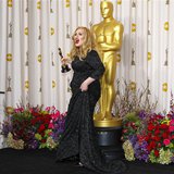Adele Adkins of Britain leaves the stage with her Oscar for Best Original Song for "Skyfall" at the 85th Academy Awards in Hollywood, Califo